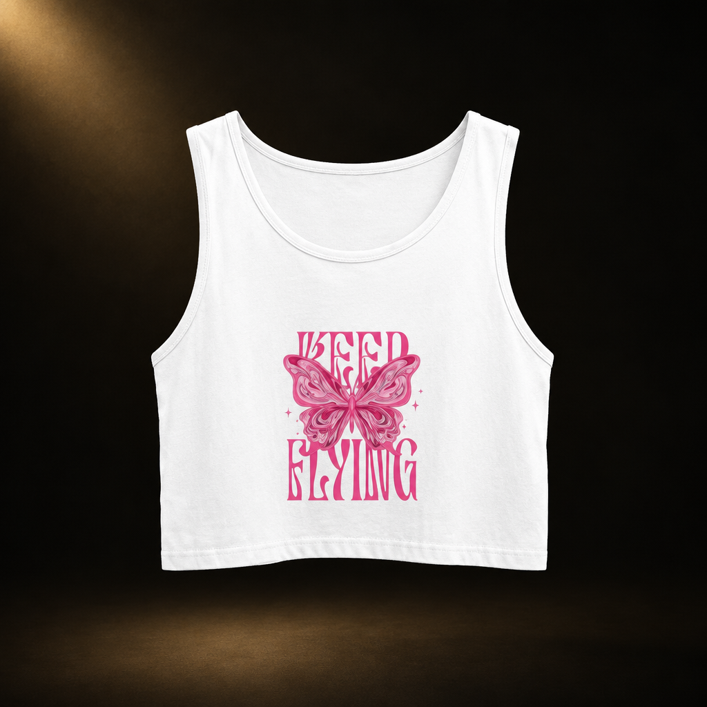 Design-first avatar of the Keep Flying white crop tank with its original pink butterfly print